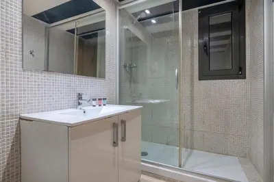 a bedroom with two beds with towels on them at The Collection Barcelona - 2 bedroom with balcony in Eixample 4-2 in Barcelona