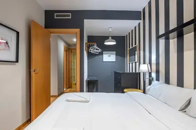 a bathroom with a sink and a shower with a mirror at The Collection Barcelona - 2 bedroom with balcony in Eixample 4-2 in Barcelona