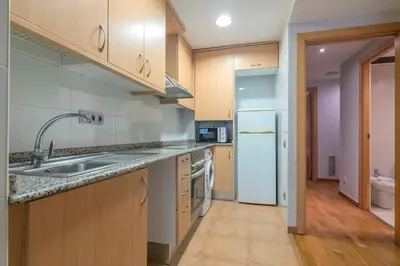 a living room with a couch and a flat screen tv at The Collection Barcelona - Modern and bright apartment in Eixample 5-2 in Barcelona