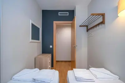 a kitchen with a sink and a refrigerator at The Collection Barcelona - Modern and bright apartment in Eixample 5-2 in Barcelona