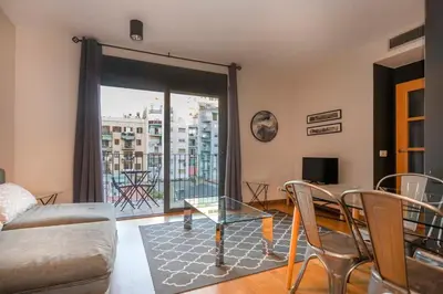 a kitchen with a washing machine and a washer at The Collection Barcelona - Modern and bright apartment in Eixample 3-1 in Barcelona
