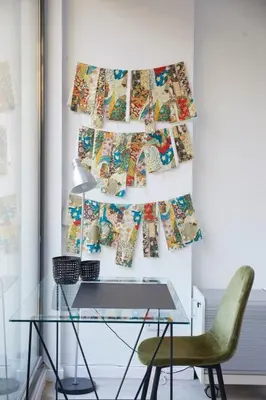 a glass desk and a green chair in a room at The Collection Barcelona - Classy 3BD - 2BTH with private patio in Eixample in Barcelona