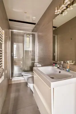 a bathroom with a sink and a toilet at The Collection Barcelona - Gorgeous 4bed 4bath close to City Center in Barcelona