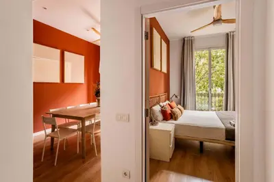a bedroom with a bed and a dining room at The Collection Barcelona - Gorgeous 4bed 4bath close to City Center in Barcelona