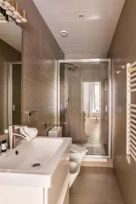 a bathroom with a sink and a toilet and a shower at The Collection Barcelona - Perfectly located 4bed 4bath apartment in Eixample in Barcelona