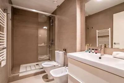 a bathroom with a sink and a toilet and a shower at The Collection Barcelona - Beautiful 4bd 4ba apartment in Eixample District in Barcelona