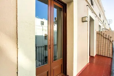 a living room with a couch and a table at The Collection Barcelona - Centric 3bedroom in Las Ramblas 2 1B in Barcelona