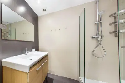 a bathroom with a sink and a shower at The Collection Barcelona - 4bedroom apart with balcony in Las Ramblas 3-2 in Barcelona