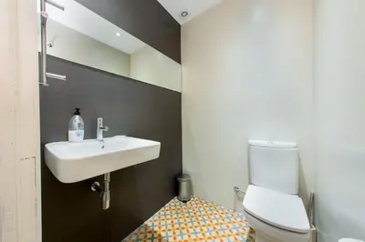a bathroom with a shower and a toilet and a sink at The Collection Barcelona - 4 bedroom apartment with a balcony in Las Ramblas 2 2 in Barcelona