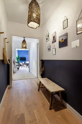 a living room with a table and a view of the ocean at The Collection Barcelona - Plaza Catalunya cozy 4 Bedroom in Barcelona