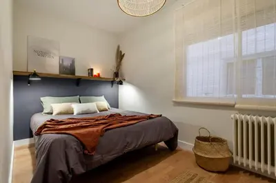 a bedroom with a bed and a window at The Collection Barcelona - Plaza Catalunya cozy 4 Bedroom in Barcelona