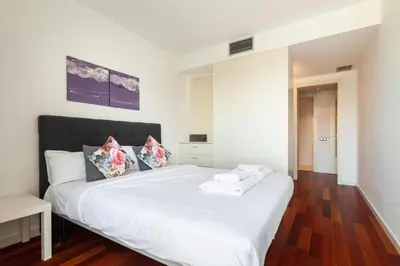 a dining room with a table and chairs at The Collection Barcelona - Plaça Catalunya Modern 2bedroom with balcony in Barcelona
