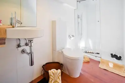 a bathroom with a toilet and a sink at The Collection Barcelona - Luxury Duplex Apartment in the Heart of Barcelona in Barcelona