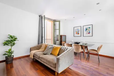 a bedroom with a bed and a ceiling fan at The Collection Barcelona - Plaza Urquinaona 3-Bedroom Suite in Barcelona