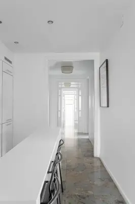 a white bedroom with a bed and a window at The Collection Barcelona - Placa Catalunya Luminous and Exclusive 5Bd Penthouse in Barcelona