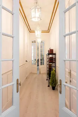 a kitchen with white cabinets and a sink at The Collection Barcelona - Placa Catalunya V Charming and Exquisite 5Bd Apartment with Large Balcony in Barcelona