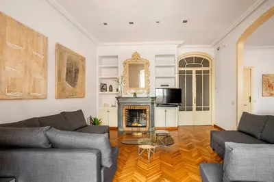 a living room with two couches and a fireplace at The Collection Barcelona - Huge historic 5BD with private Terrace! in Barcelona