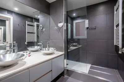 a bathroom with two sinks and a shower at The Collection Barcelona - Classy 3bed 3bath apartment in Eixample in Barcelona