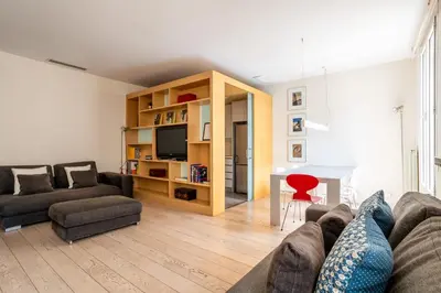 a living room with a couch and a table at The Collection Barcelona - Classy 3bed 3bath apartment in Eixample in Barcelona
