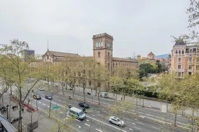 a city street with cars parked in front of a building at The Collection Barcelona - Amazing 5 bd 5 bathroom next to Plaza Catalunya in Barcelona