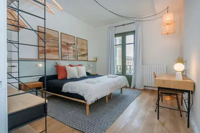 a bedroom with a bed and a desk in it at The Collection Barcelona - Amazing 5 bd 5 bathroom next to Plaza Catalunya in Barcelona