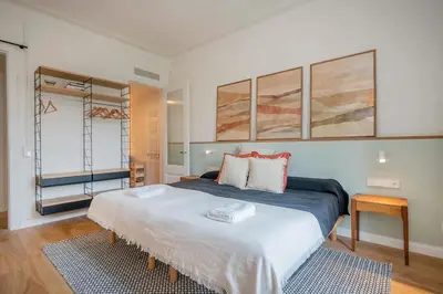 a bedroom with a large bed in a room at The Collection Barcelona - Amazing 5 bd 5 bathroom next to Plaza Catalunya in Barcelona
