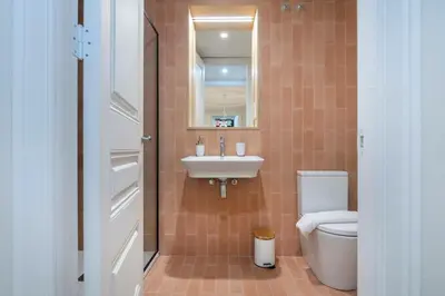 a bathroom with a sink and a toilet at The Collection Barcelona - Amazing 5 bd 5 bathroom next to Plaza Catalunya in Barcelona