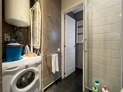 a laundry room with a washing machine in a bathroom at Stay U-nique Apartments Est in Barcelona