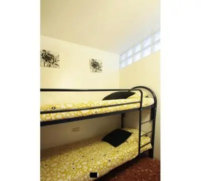 a room with two bunk beds in a room at GOOD APARTMENTS gran via 3 bedrooms in Barcelona