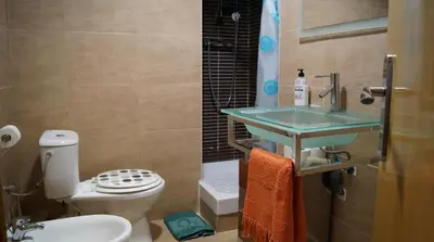 a bathroom with a sink and a toilet at GOOD APARTMENTS gran via 3 bedrooms in Barcelona