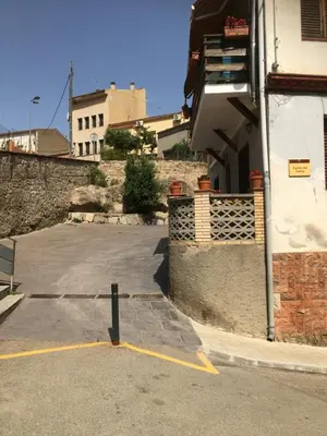 a parking lot in front of a building at Casa iaia in Monistrol