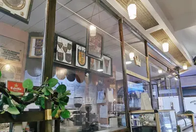 a store with a window with a display of food at Barcelona CoronaHostal in Badalona