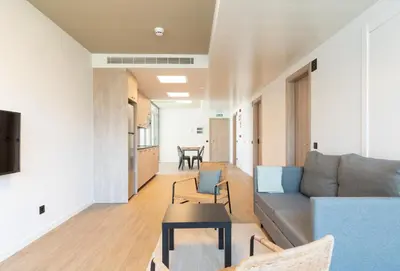 a living room with a couch and a table at Micampus Barcelona Student Residence in Barcelona