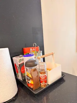 a tray with food and condiments on a table at Gracia Barcelona Apartment in Barcelona