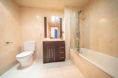a bathroom with a toilet and a sink and a shower at HomeHolidaysRentals Milos - Costa Barcelona in Pineda de Mar