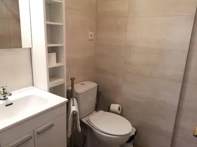 a bathroom with a toilet and a sink at ApartEasy - Atic Sants in Barcelona