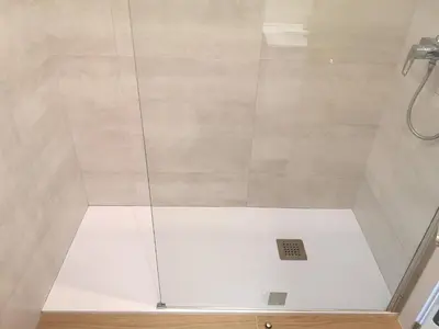 a shower with a glass enclosure in a bathroom at ApartEasy - Atic Sants in Barcelona