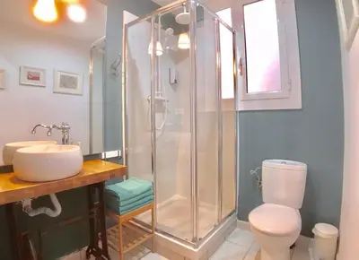 a bathroom with a shower and a toilet and a sink at LEPANTO APARTMENTS 150m FROM SAGRADA FAMILIA in Barcelona
