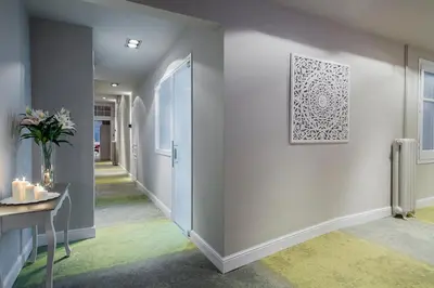 a hallway with white walls and a picture on the wall at BacHome Gallery B&B in Barcelona