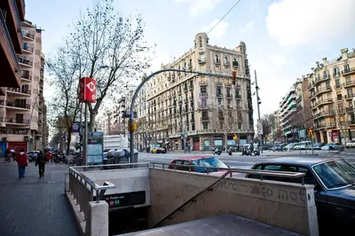 a city street with buildings and a traffic light at La Fira in Barcelona