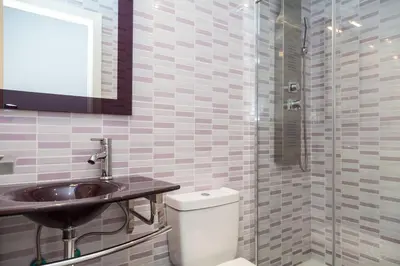 a bathroom with a toilet and a sink and a shower at Molino Fresh in Barcelona