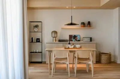 a dining room with a table and two chairs at Sabàtic Sitges Hotel, Autograph Collection in Sitges