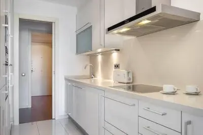 a room with a window with a table and a balcony at The Collection Barcelona - Wonderful 2-bd apart with balcony Plaza Cataluña in Barcelona