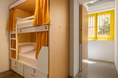an empty hallway with a yellow door in a room at The Loft House Barcelona in Barcelona