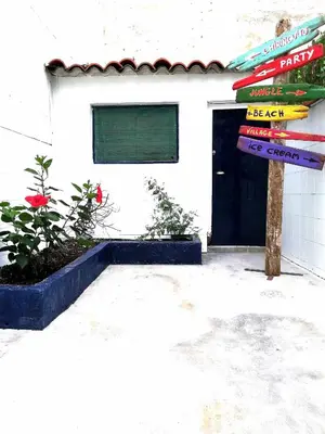 a sign in front of a building with a door at Mazi Apartments Chic in Badalona
