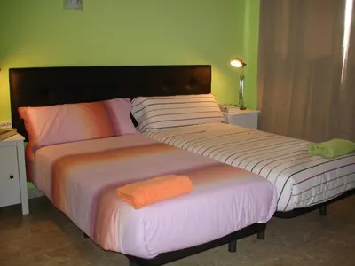 two beds sitting next to each other in a bedroom at LA NURSERY DE MAS GUILLO in San Quintín de Mediona