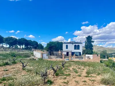 a house in the middle of a field at Masia St Salvador 1582 in Cubelles