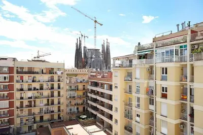 a view of a city with buildings and cranes at SAGRADA FAMILIA VIEWS Nos preocupa su seguridad. in Barcelona