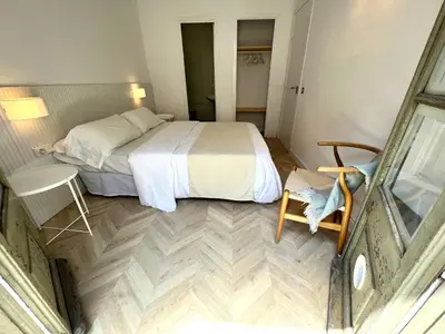 a bedroom with a bed and a table and a chair at The MO GOTIC in Barcelona