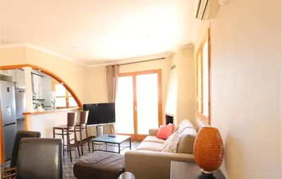 a living room with a couch and a table at Nice Home In Sant Cebria De Vallalt in Sant Cebrià de Vallalta